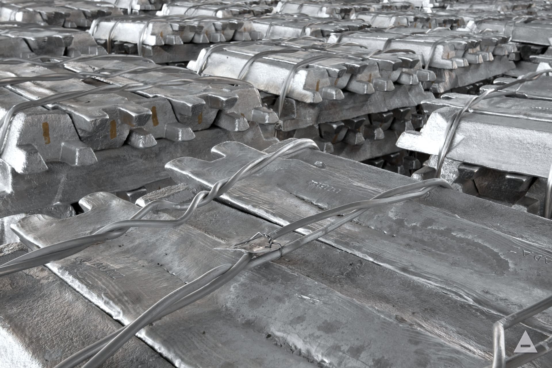 Strapped stacks of aluminium ingots in the raw-material yard